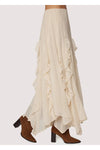 White ruffled skirt with brown boots on a white background