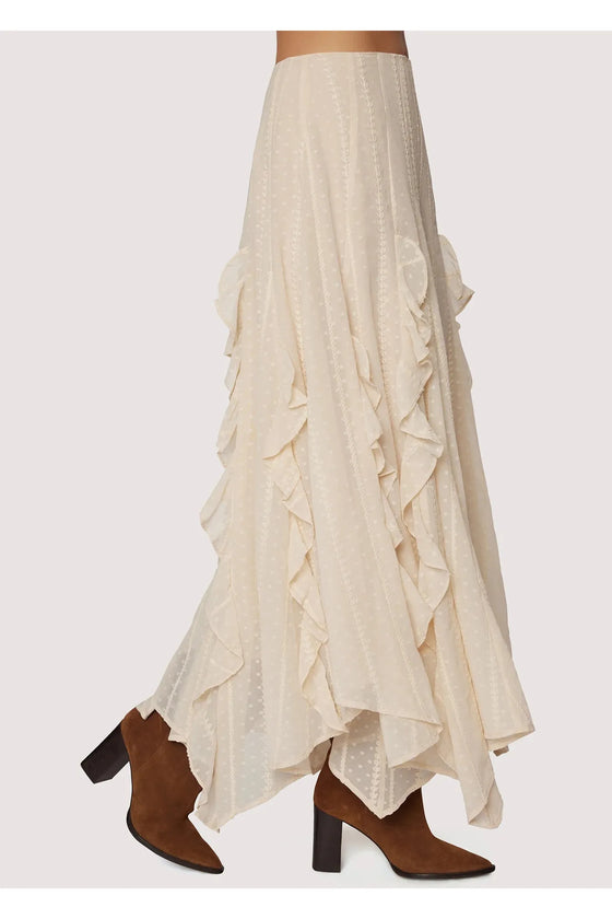 White ruffled skirt with brown boots on a white background