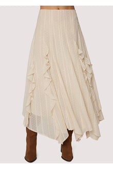  Ivory ruffled skirt with brown boots on a white background