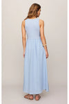 Woman shown from behind wearing a light blue sleeveless midi dress against a plain background. 